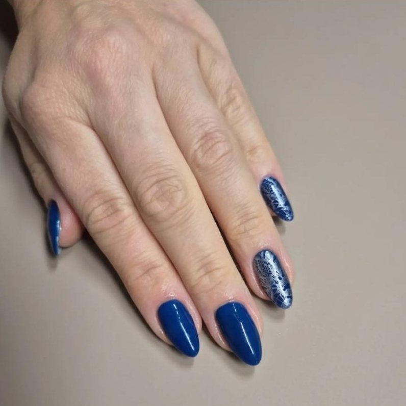 Deep navy almond nails with white lace stamping